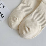 STRIPED COLOR BLOCK LETTERING SPORTS SOCKS_CWMS0964