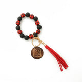LEOPARD WOOD BEAD BRACELET WITH TASSEL KEYCHAIN_CWAB5013
