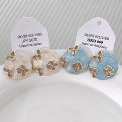 HOLLOW ZIRCON GEOMETRIC FLOWER EARRINGS_CWAJE2040