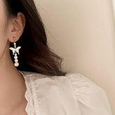 NEW NATURAL MOTHER OF PEARL BUTTERFLY EARRINGS_CWAJE3114