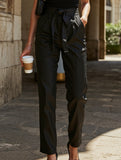 Black high-waisted lantern pants with bow