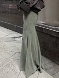 waist-hugging floor-length skirt