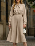 Elegant pleated dress with bow tie collar