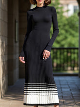 Pleated black and white striped sweater dress