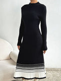 Pleated black and white striped sweater dress