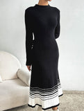 Pleated black and white striped sweater dress