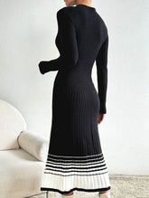 Pleated black and white striped sweater dress