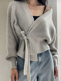 V-neck fitted waist belted knit cardigan