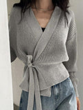 V-neck fitted waist belted knit cardigan