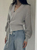 V-neck fitted waist belted knit cardigan