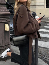 Stylish short belted coat with large lapel