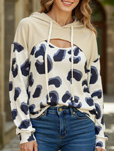 Leopard print paneled hollow hooded sweatshirt