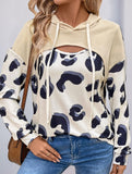 Leopard print paneled hollow hooded sweatshirt