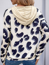Leopard print paneled hollow hooded sweatshirt