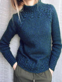 Solid color cable knit sweater