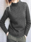Solid color cable knit sweater