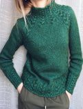 Solid color cable knit sweater
