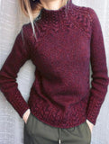 Solid color cable knit sweater