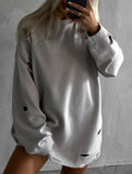 Loose-fitting crew neck ripped sweater
