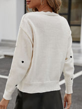 Heart-patterned jacquard V-neck ruffled knit sweater