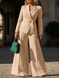 Fashionable belted jacket and trouser suit for women