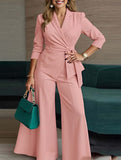 Fashionable belted jacket and trouser suit for women