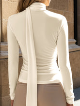 Slim-fit long-sleeved pleated top