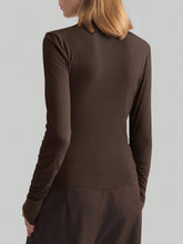 Asymmetrical turtleneck fitted top