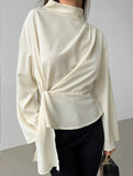 Waist-cinching long-sleeved slit shirt