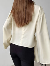 Waist-cinching long-sleeved slit shirt