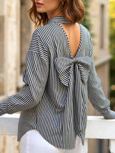A striped printed long-sleeved shirt with a bow