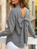 A striped printed long-sleeved shirt with a bow