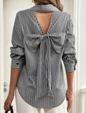 A striped printed long-sleeved shirt with a bow
