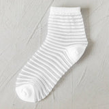 BLACK AND WHITE JACQUARD TRANSPARENT MID TUBE SOCKS_CWMS0414