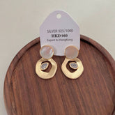 ADVANCED SHELL ROUND PENDANT EARRINGS_CWAJE1354