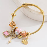 ADJUSTABLE GOLD BRACELET WITH CROWN KEY HEART_CWMM8565