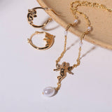 SWEET CUPID PEARL BOW COMPASS DANGLE EARRINGS_CWAJE5107