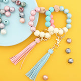 PRINTED WOOD BEAD BRACELET KEYCHAIN WITH TASSEL_CWMM7025
