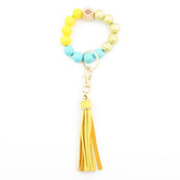 PRINTED WOOD BEAD BRACELET KEYCHAIN WITH TASSEL_CWMM7025