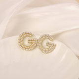 NEW SIMPLE HOLLOW FLOWER ENAMEL EARRINGS_CWAJE3991