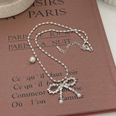 Womens Pearl And Silver Bow Pendant Necklace