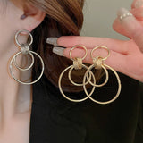 MINIMALIST GLOSSY CIRCULAR COMMUTING EARRINGS_CWAJE2049