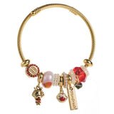 GOLD STAINLESS STEEL BRACELET WITH ANIMAL CHARMS_CWMM8574
