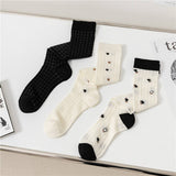 HOLLOW JACQUARD MIDDLE CALF SOCKS_CWMS0650