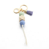 LEOPARD WOOD BEAD KEYCHAIN WITH MINI TASSEL_CWMM7022