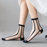 BLACK AND WHITE JACQUARD TRANSPARENT MID TUBE SOCKS_CWMS0414