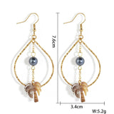 NICHE HOLLOW BLACK SHELL PALM TREE EARRINGS_CWMM4364