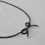 SIMPLE AND DELICATE BOW HANDMADE BEADED NECKLACE_CWAJE2136
