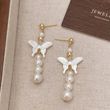 NEW NATURAL MOTHER OF PEARL BUTTERFLY EARRINGS_CWAJE3114