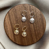 DEVILS EYE TOTEM ROUND ART EARRINGS_CWAJE1775